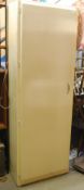 A painted shabby chic kitchen / larder cupboard with a single full length door and raised on stub