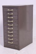 A retro 1970's Industrial grey metal pedestal filing cabinet / bank of drawers having loop