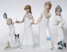 A collection of Nao figurines of girls to include sleepy girl, girl with dog by feet,