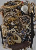 A collection of costume jewellery to include necklaces, bracelets, beads, watches,