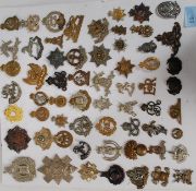 A good collection of British cap badges to include Royal Hussars , Edgpt Corps ,