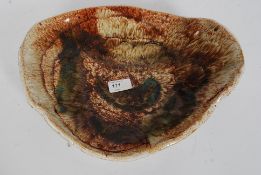 A 20th century studio pottery drip glaze fruit bowl having abstract design bearing unsigned W36cm