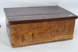 A vintage pine box containing treen items  to include candlesticks and decorative items etc