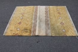 A Kadian Tibetan Chinese 100% wool rug being handwoven with shades of grey and gold having chevron