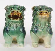 A pair of glazed circa mid century Chinese temple dogs.
