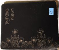 An Edwardian postcard album, containing a quantity of mostly loose assorted postcards.