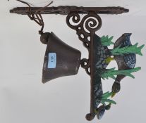 An exterior cast iron wall hanging bell,