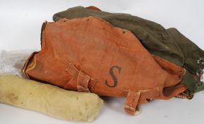 A collection of vintage military kit bags and jackets please see images
