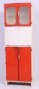 A 1950's vintage retro two tone kitchen cabinet having red doors and fall front centre.