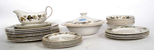 A Royal Doulton part dinner service in the Larchmont pattern consisting of plates, bowls,