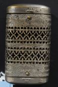 A Victorian stamped metal vesta handwarmer combination of lozenge form with fret worked centre