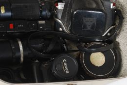 A large box of cameras from the 20th century to include examples from Canon, Praktica, Pentacon,