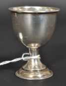 A silver hallmarked egg cup having illegible hallmarks to the underside. Total weight 17.