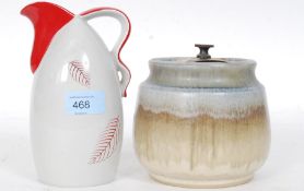 A red and grey painted Crown Devon jug, along with a Denby style Aonian humidor.