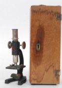 A small cased travel microscope by SR Stubbs in original wooden case along with instructions and