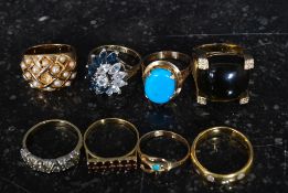 A collection of gilded silver 925 and yellow metal ladies dress rings to include garnet paste stone