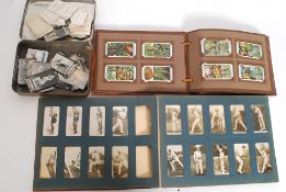 A collection of assorted cigarette cards