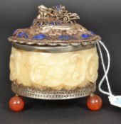 A Chinese silver and silver plated alabaster trinket pot of circular form raised on glass ball feet.