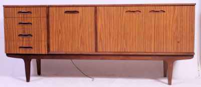 A retro Melamine sideboard having a bank of four drawers and shelved cupboard space.