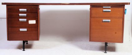 A large retro 1970's teak wood curved top twin pedestal desk having raised,
