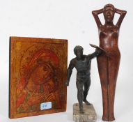 A religious Ikon panel on wood together with a wooden nutcracker in the form of a lady and a bronze