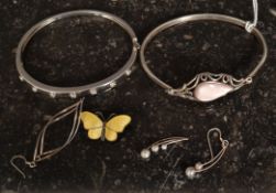 2 silver ladies 925 contemporary bangles together with a silver and enamel butterfly brooch,