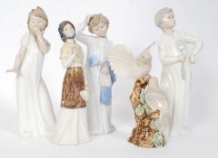 A collection Nao figurines to include fly swatting boy,