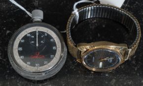 A vintage Omega stopwatch  with black face and subsiduary dial.