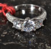 A white metal 925 silver and cz ladies three stone ring