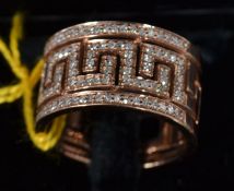 A 9ct yellow gold and diamond ring in the greek key style, .