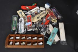 A collection of collectors tea spoons some with silver hallmarked along with ceramic collectors