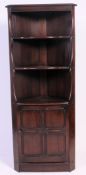 A jaycee style jacobean revival oak corner cabinet.