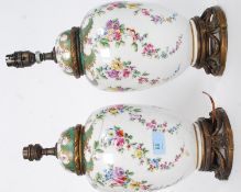 A good pair of 19th century porcelain French style antique urn lamps, fitted with brass.