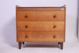 A Gordon Russell of Broadway, Worcestershire oak crop centre dressing table and stool.