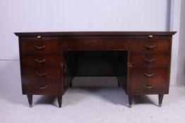 A vintage twin pedestal oak office desk with drawers to the pedestal.