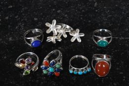 A collection of white metal 925 silver ladies dress rings to include flower head rings,