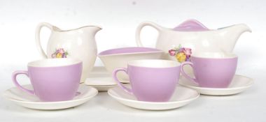A Bristol Poutney Lilac & Sweet pea retro decorated tea service.