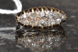 A ladies gold and diamond ring ( tests 14ct-18ct) The ring with inset 12 diamond,