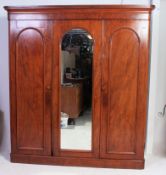 A Victorian mahogany triple wardrobe compactum linen press.