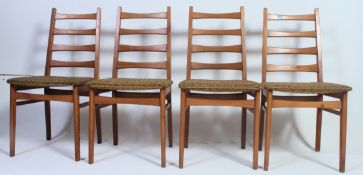 A set of 4 retro 1960's dining chairs having railed backs and upholstered seats.