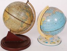 A vintage Chad Valley tin globe on a faux wood tin base,