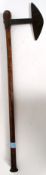 An African battle axe ? having a hand forged blade with a tapering weighted shaft