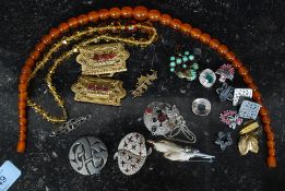 A collection of vintage costme jewellery to include glass beaed necklace, cuff links, ear rings,