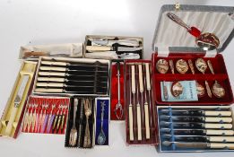 A selection of boxed flatware to include knife sets,