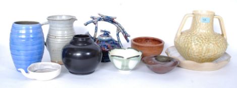 A collection of 10x pieces of assorted studio pottery to include an unusual teapot, and other items.