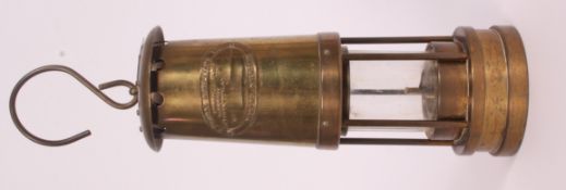 A vintage brass Miners lamp with makers plaque E.