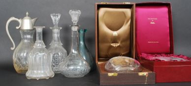 A box of decanters to include two cased, along with pewter topped jugs etc.