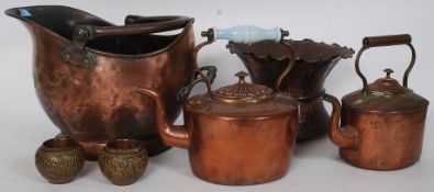 A quantity of antique copper to include kettles, coal scuttle,
