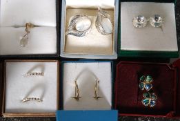 A collection of ladies earrings to include yellow metal and white metal examples, floral shaped,