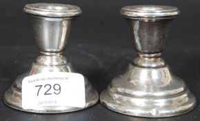 A pair of late Victorian silver hallmarked stub candlesticks with illegible marks likely 1900 ( see